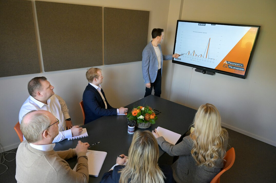 team discussing charts